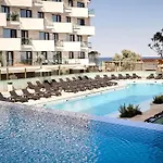 Costan In Infinity Pool And *